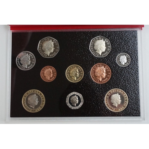 202 - A collection of four Royal Mint United Kingdom Queen Elizabeth II annual proof coin sets to include ... 