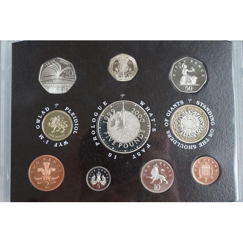 202 - A collection of four Royal Mint United Kingdom Queen Elizabeth II annual proof coin sets to include ... 