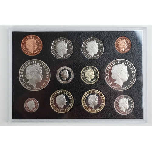 202 - A collection of four Royal Mint United Kingdom Queen Elizabeth II annual proof coin sets to include ... 