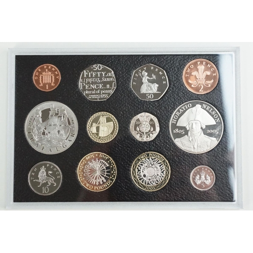 202 - A collection of four Royal Mint United Kingdom Queen Elizabeth II annual proof coin sets to include ... 