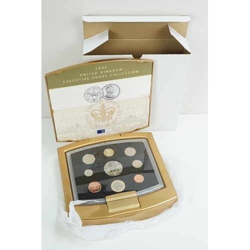 202 - A collection of four Royal Mint United Kingdom Queen Elizabeth II annual proof coin sets to include ... 