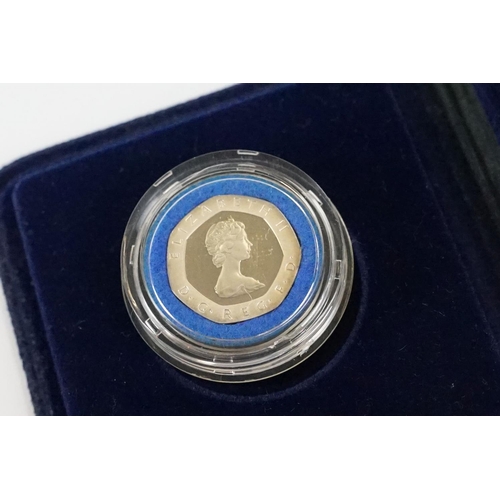 28 - A collection of four Royal Mint silver proof coins to include the 1982 20p coin, 1988 £1 coin, 1997 ... 