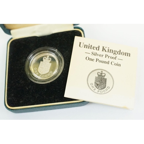 28 - A collection of four Royal Mint silver proof coins to include the 1982 20p coin, 1988 £1 coin, 1997 ... 