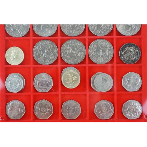 40 - A collection of mainly British pre decimal and commemorative coins contained within three Lindner di... 