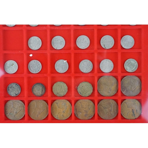 40 - A collection of mainly British pre decimal and commemorative coins contained within three Lindner di... 