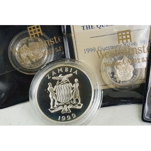 49 - A large collection of over fifty silver proof coins to include Crowns, $10, £5 and £1 examples, all ... 