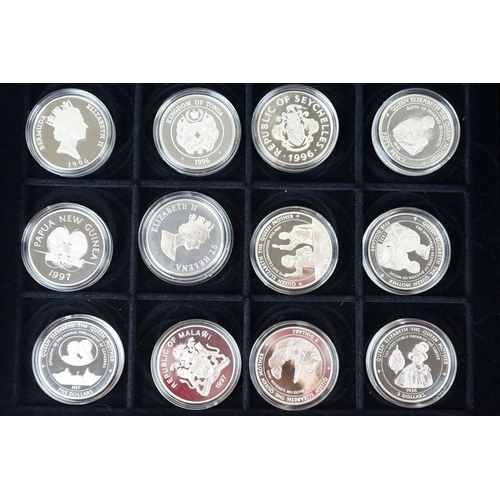 49 - A large collection of over fifty silver proof coins to include Crowns, $10, £5 and £1 examples, all ... 