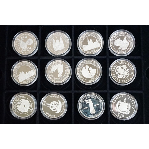 49 - A large collection of over fifty silver proof coins to include Crowns, $10, £5 and £1 examples, all ... 