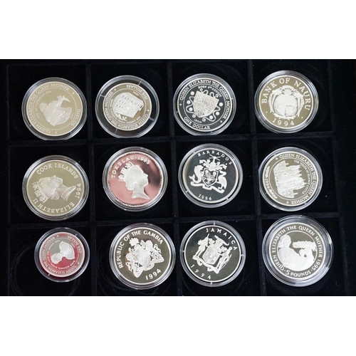 49 - A large collection of over fifty silver proof coins to include Crowns, $10, £5 and £1 examples, all ... 