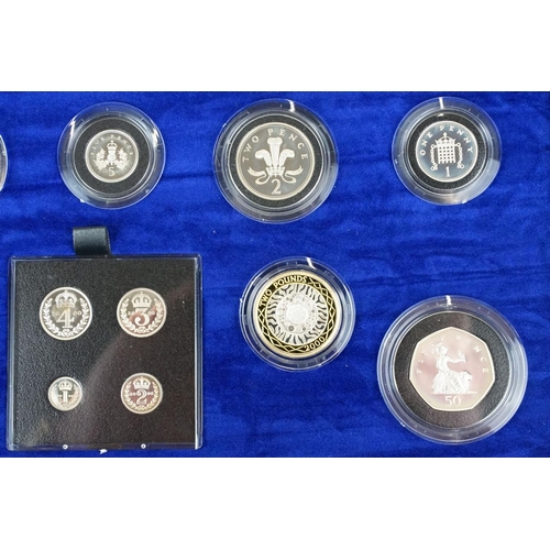 64 - A Royal Mint UK Millenium Silver Collection coin set, comprising nine coins and four Maundy Coins, i... 