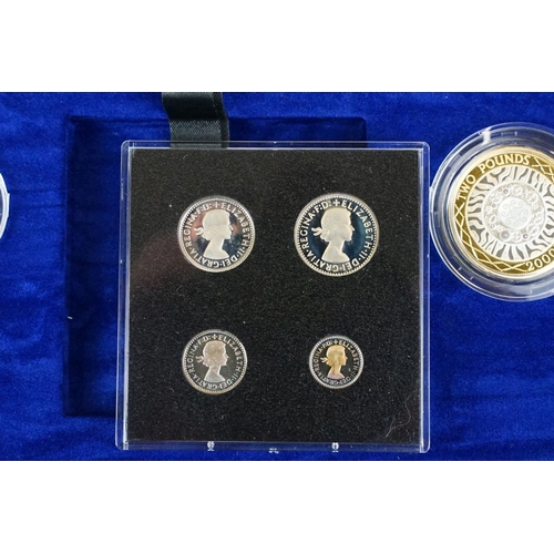 64 - A Royal Mint UK Millenium Silver Collection coin set, comprising nine coins and four Maundy Coins, i... 