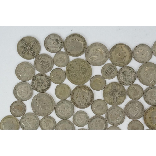 74 - A large collection of British pre decimal silver coins to include half crowns, florins, shillings an... 