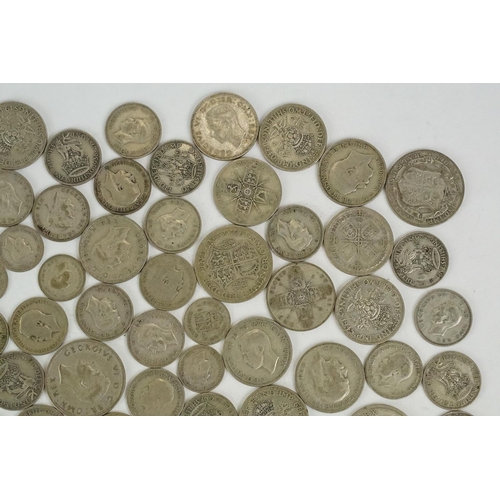 74 - A large collection of British pre decimal silver coins to include half crowns, florins, shillings an... 