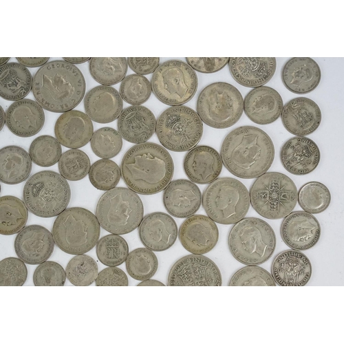 74 - A large collection of British pre decimal silver coins to include half crowns, florins, shillings an... 