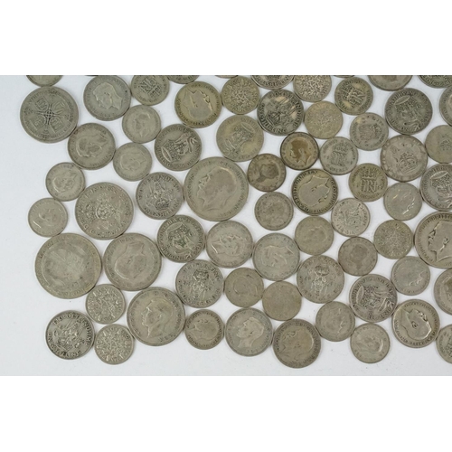 74 - A large collection of British pre decimal silver coins to include half crowns, florins, shillings an... 