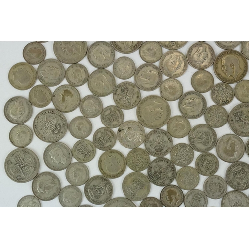 74 - A large collection of British pre decimal silver coins to include half crowns, florins, shillings an... 