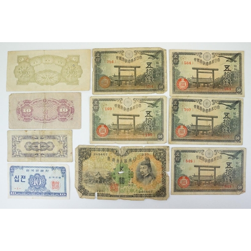 76 - A large collection of mainly Japanese Government Wartime banknotes together with other examples.