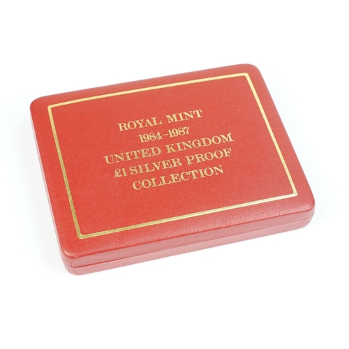 84 - A Royal Mint Queen Elizabeth II 1984-1987 £1 silver proof four coin set, encapsulated within fitted ... 