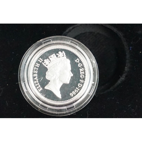 86 - A Royal Mint Queen Elizabeth II 1984-1987 £1 piedfort silver proof four coin set, encapsulated withi... 