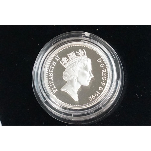 87 - A collection of four Royal Mint Queen Elizabeth II £1 silver proof coins to include 1999, 2002, 2003... 