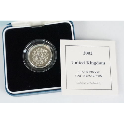 87 - A collection of four Royal Mint Queen Elizabeth II £1 silver proof coins to include 1999, 2002, 2003... 