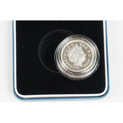 87 - A collection of four Royal Mint Queen Elizabeth II £1 silver proof coins to include 1999, 2002, 2003... 