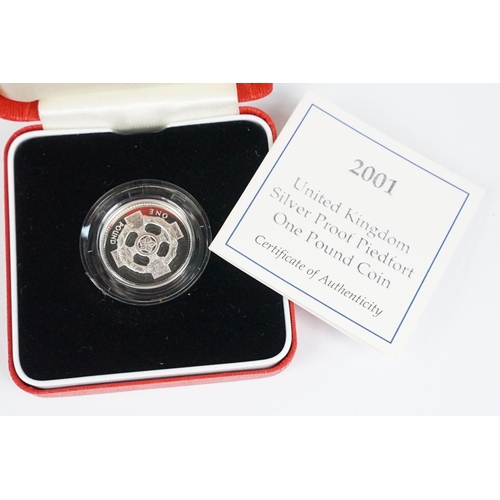 89 - A collection of four Royal Mint Queen Elizabeth II £1 silver proof coins to include 2002, 2000, 2003... 