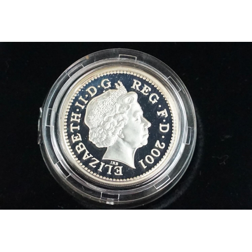 89 - A collection of four Royal Mint Queen Elizabeth II £1 silver proof coins to include 2002, 2000, 2003... 