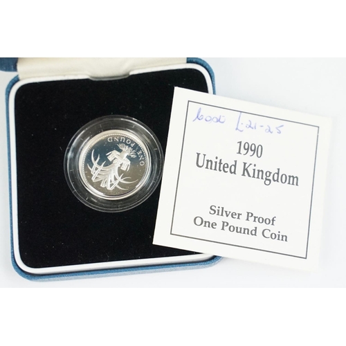 90 - A collection of four Royal Mint Queen Elizabeth II £1 silver proof coins to include 1993, 1998, 1989... 