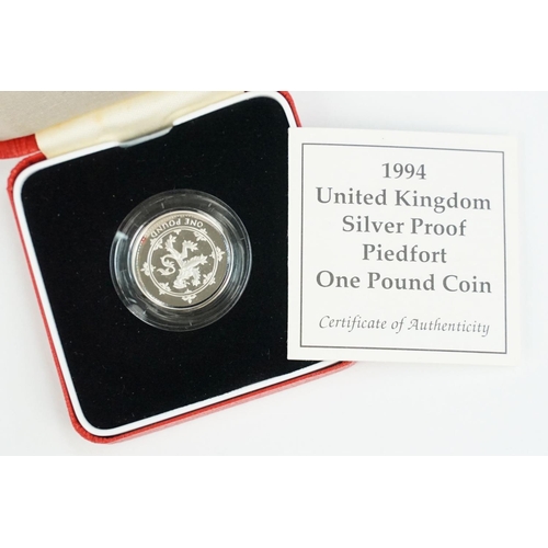 91 - A collection of four Royal Mint Queen Elizabeth II £1 silver proof coins to include 2001, 1996, 1994... 