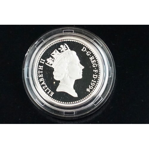 91 - A collection of four Royal Mint Queen Elizabeth II £1 silver proof coins to include 2001, 1996, 1994... 