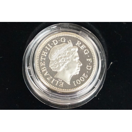 91 - A collection of four Royal Mint Queen Elizabeth II £1 silver proof coins to include 2001, 1996, 1994... 