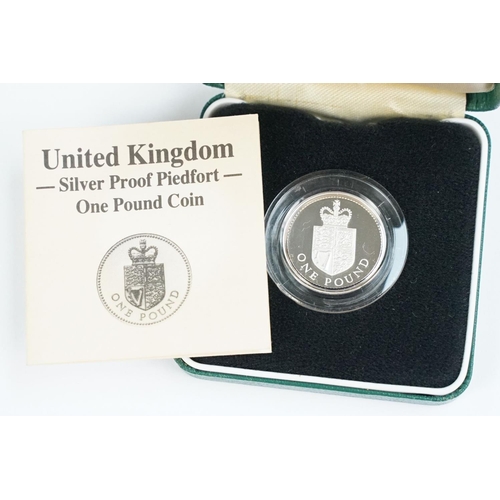 92 - A collection of four Royal Mint Queen Elizabeth II £1 silver proof coins to include 1988, 1989, 2016... 