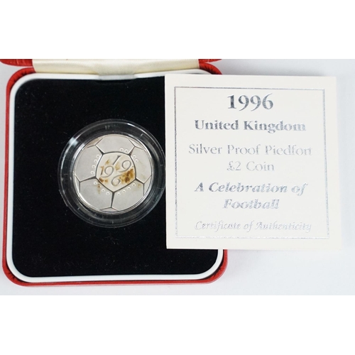 95 - A collection of four Royal Mint Queen Elizabeth II £2 silver proof coins to include 1994, 1996, 1999... 