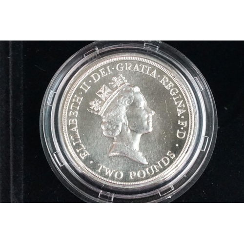 97 - A collection of four Royal Mint Queen Elizabeth II £2 silver proof coins to include 2001, 1996, 1986... 