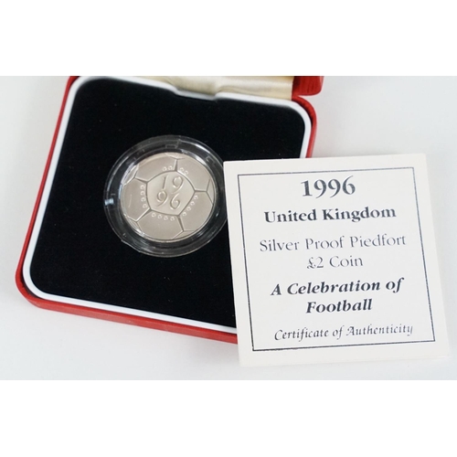 97 - A collection of four Royal Mint Queen Elizabeth II £2 silver proof coins to include 2001, 1996, 1986... 