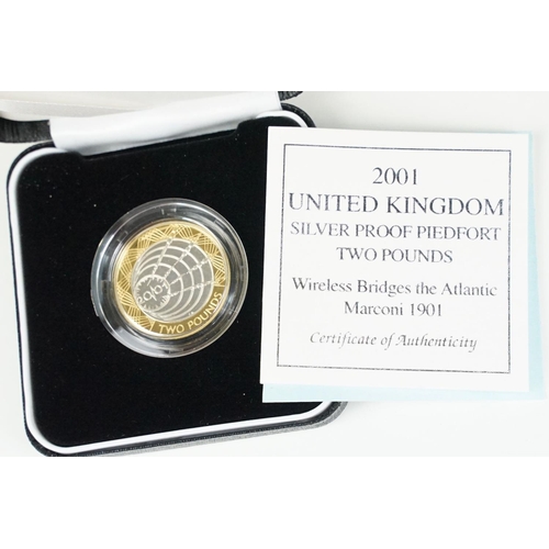 97 - A collection of four Royal Mint Queen Elizabeth II £2 silver proof coins to include 2001, 1996, 1986... 