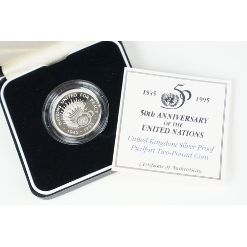 97 - A collection of four Royal Mint Queen Elizabeth II £2 silver proof coins to include 2001, 1996, 1986... 