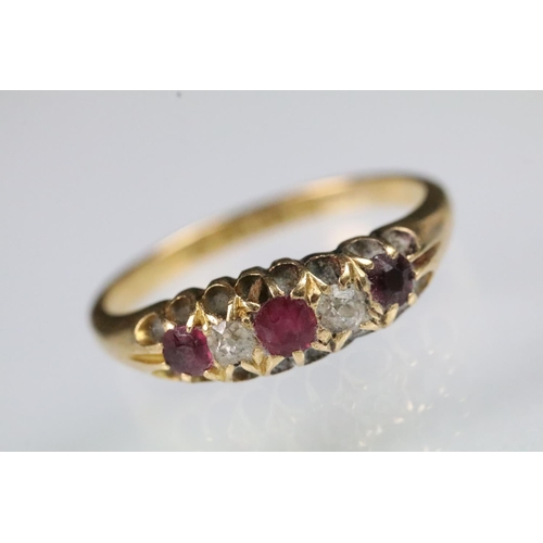 35 - 19th Century Victorian 18ct gold ruby and diamond ring. The ring being set with three round cut rubi... 