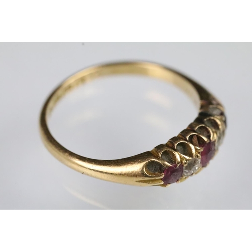 35 - 19th Century Victorian 18ct gold ruby and diamond ring. The ring being set with three round cut rubi... 