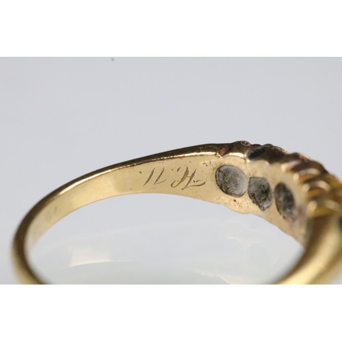 35 - 19th Century Victorian 18ct gold ruby and diamond ring. The ring being set with three round cut rubi... 