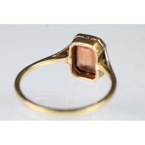 51 - Art Deco 18ct gold and orange topaz ring being set with an rectangular mixed cut orange topaz in a b... 
