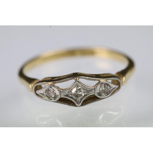54 - Art Deco 18ct gold and diamond ring having a pierced panel head set with three round cut diamonds. M... 