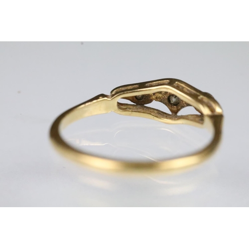 54 - Art Deco 18ct gold and diamond ring having a pierced panel head set with three round cut diamonds. M... 