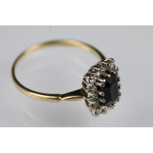 56 - 18ct gold sapphire and diamond ring. The ring being set with a rectangular step cut sapphire to cent... 