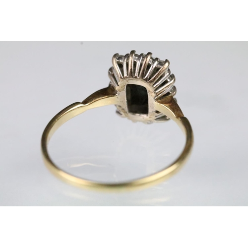 56 - 18ct gold sapphire and diamond ring. The ring being set with a rectangular step cut sapphire to cent... 