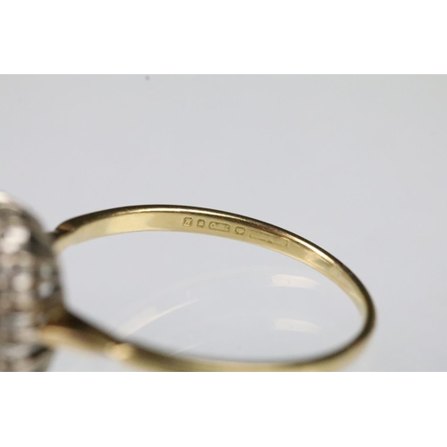 56 - 18ct gold sapphire and diamond ring. The ring being set with a rectangular step cut sapphire to cent... 