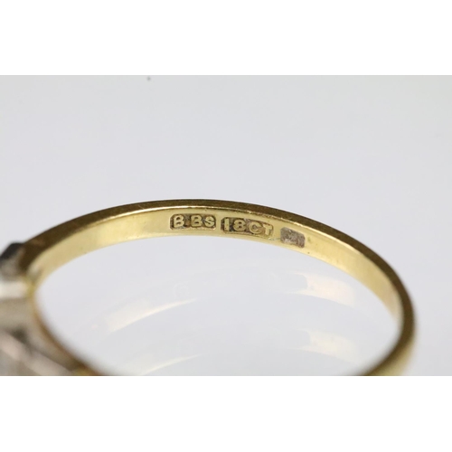 58 - Art Deco 18ct gold and diamond ring. The ring set with two round brilliant cut diamonds to the head ... 