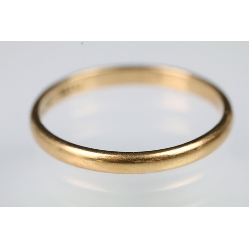 59 - 22ct gold wedding band ring. The ring of plain D form. Hallmarked London 1941. Size R.