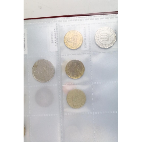 236 - A very large collection of mixed World coins in alphabetical order within six collectors albums.